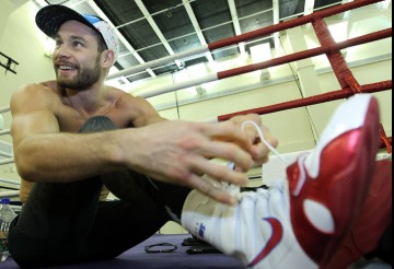 Chris "Real Rocky" Algieri ties his shoes during training at the Venetian Macao Resort 