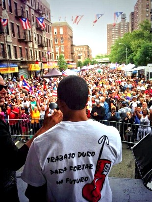 Felix Verdejo infront of a large crows of supporters / fans.