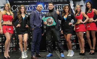 Three-time world champion Miguel Cotto of Puerto Rico and WBC world Middleweight champion Sergio Martinez from Argentina (surrounded by the Tecate girls and the Top Rank Knockouts) 