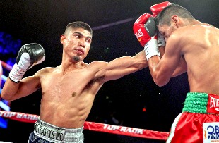 Mikey Garcia (Left in photo) wins a 12-round unanimous decision over Juan Carlos Burgos.