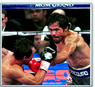 Manny Pacquiao lands punch on Juan Manuel Marquez